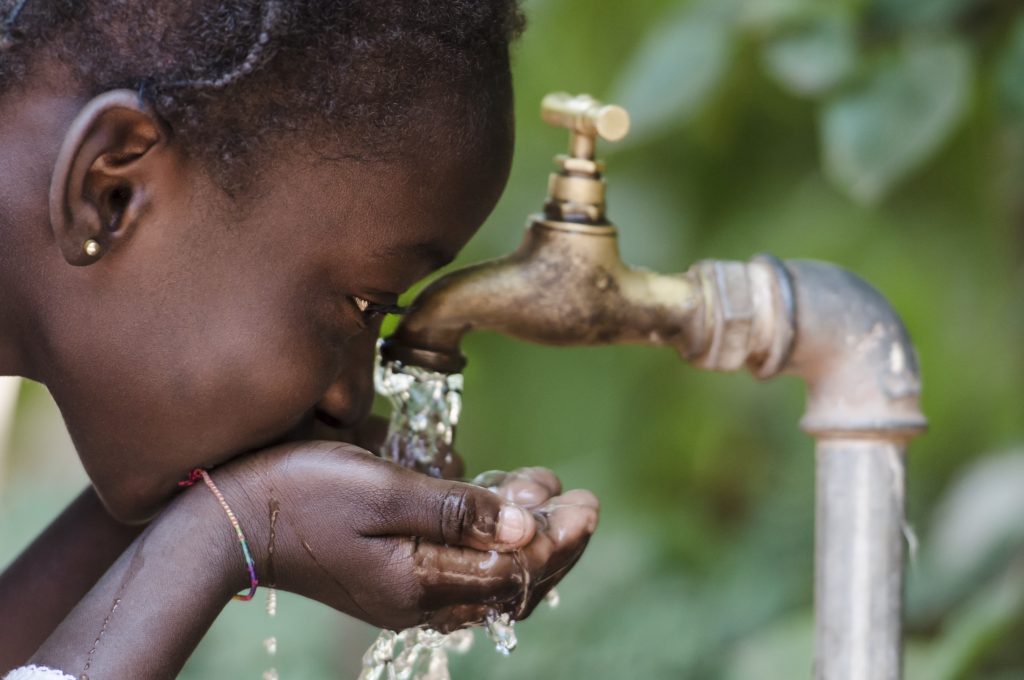 Clean Fresh Water Scarcity Symbol: Black Girl Drinking from Tap